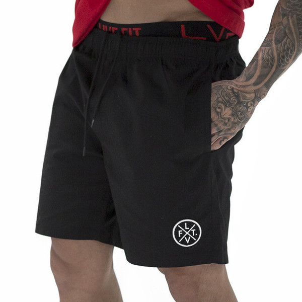 Alkalmi férfi rövidnadrág három színben emblémával