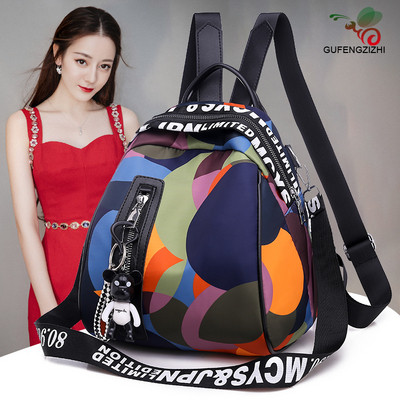 Colorful women`s backpack with accessory