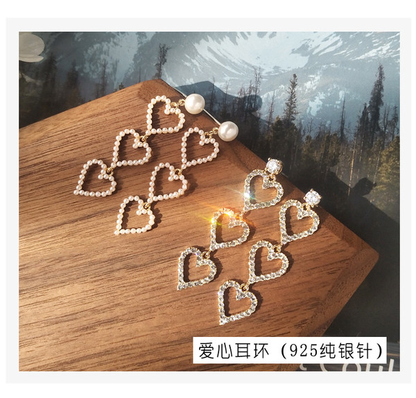 Elegáns női hosszú fülbevaló gyöngyökkel