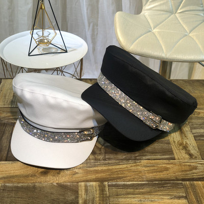 Elegant women`s cap with stones and metal buckle in black, white and beige