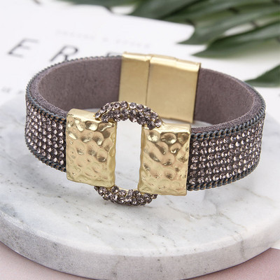 Elegáns női karkötő kövekkel több színben és fém csattal