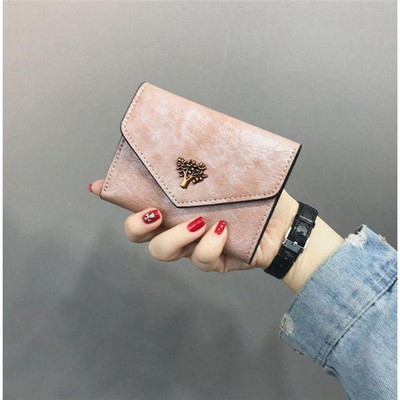 Κομψό γυναικείο  πορτοφόλι με μεταλλικό στοιχείο σε διάφορα χρώματα