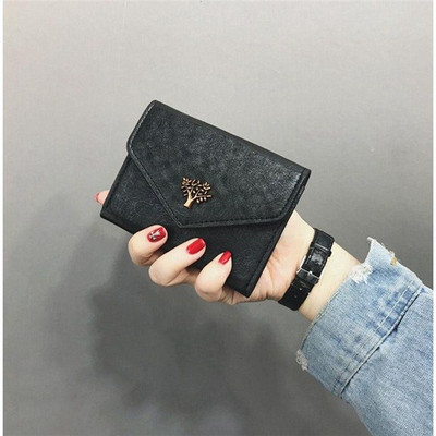 Κομψό γυναικείο  πορτοφόλι με μεταλλικό στοιχείο σε διάφορα χρώματα