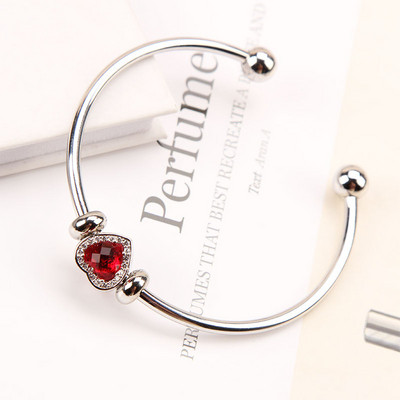 Stílusos női karkötő kövekkel több színben