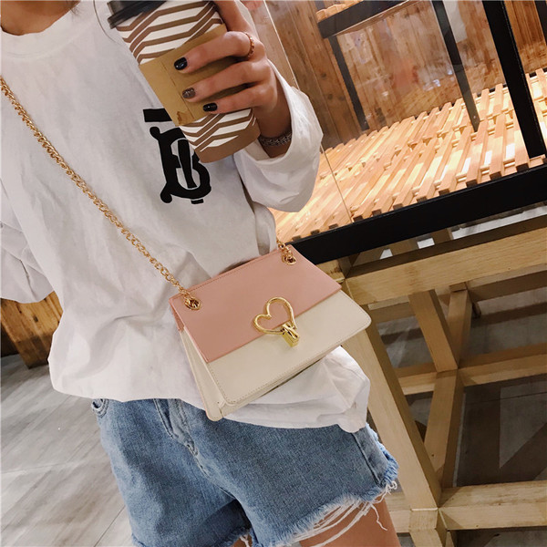 Eko bőrből készült stílusos női táska fém díszítéssel három színben