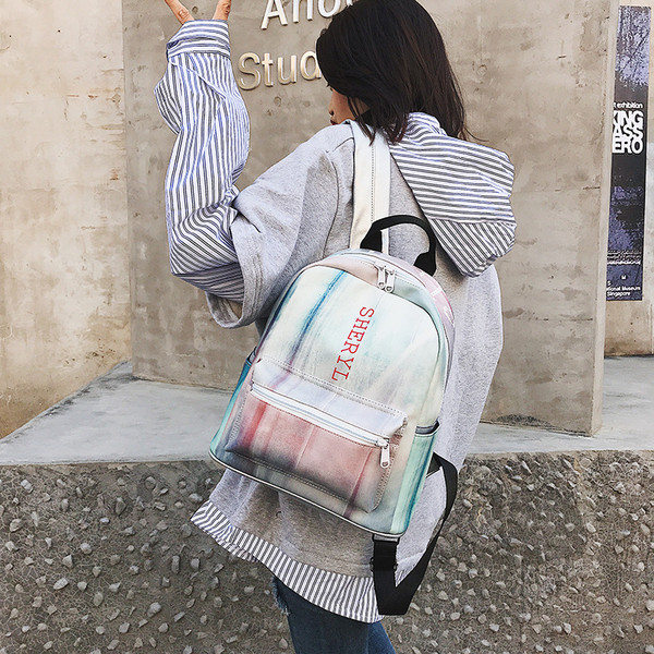 Rucsac modern de dama in culoare irizata cu buzunar frontal