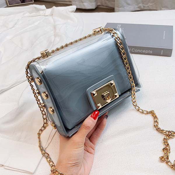 Stílusos női táska fém fogantyúval több színben