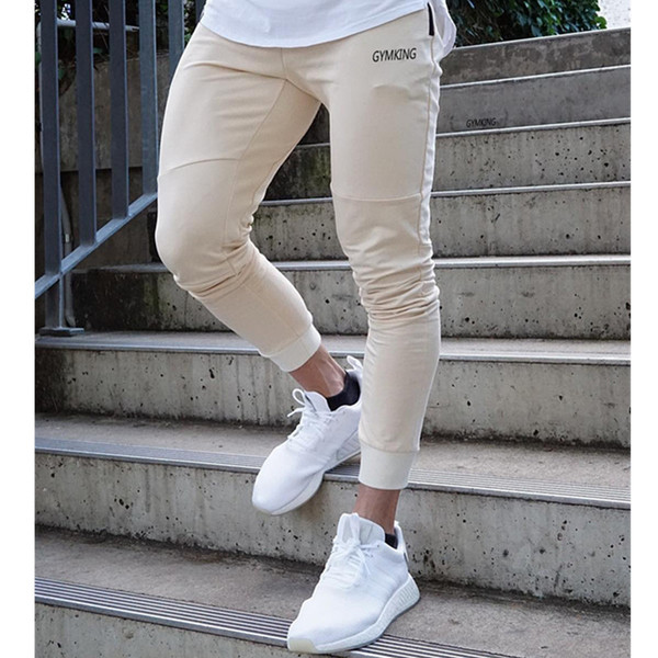 Pantaloni sport pentru bărbați în patru culori cu inscripție și cravate