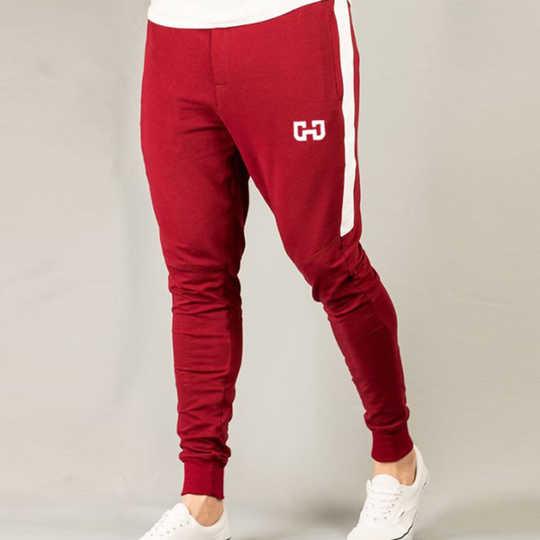 Férfi sportnadrág több színben, zsebekkel