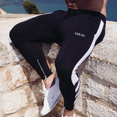 Férfi sportnadrág két színben, cipzárral