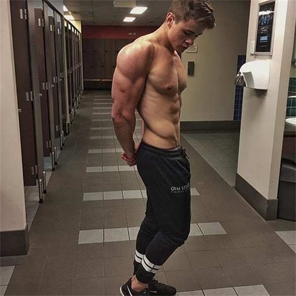 Férfi sportnadrág fekete színben, fehér csíkokkal