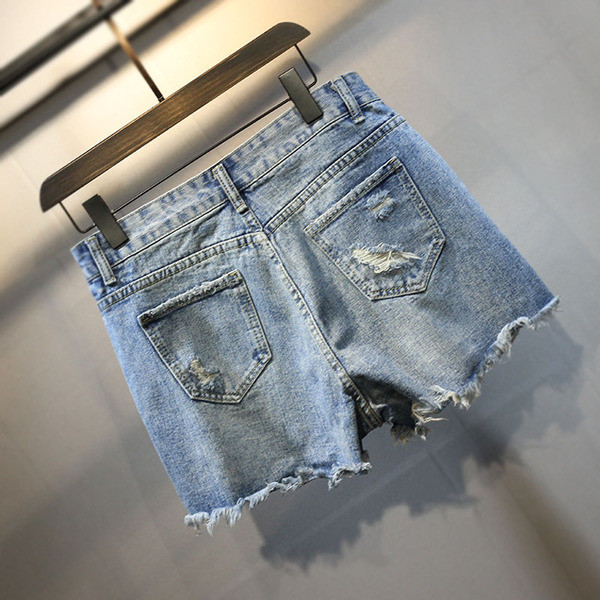 Stílusos női szoknya-nadrág szakadt motívumokkal