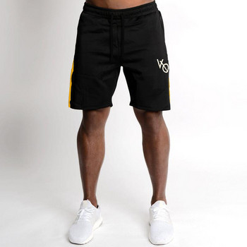 Спортен мъжки къс панталон в черен и жълт цвят