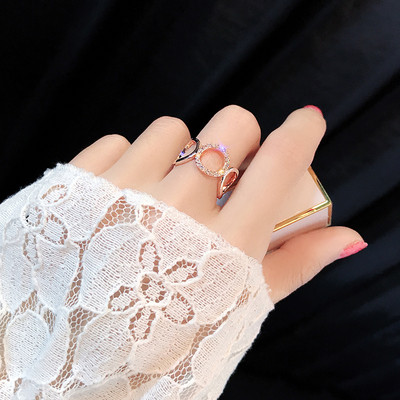 Current women`s ring with decorative stones