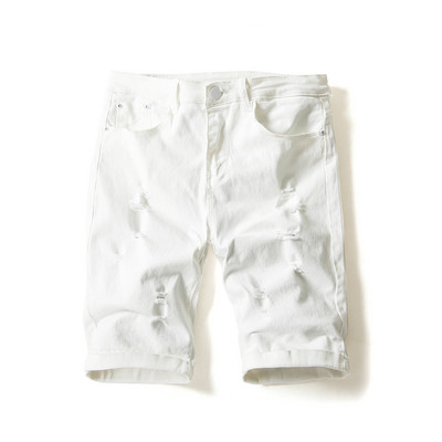 Modern férfi farmer fehér és fekete színben, szakadt motívumokkal