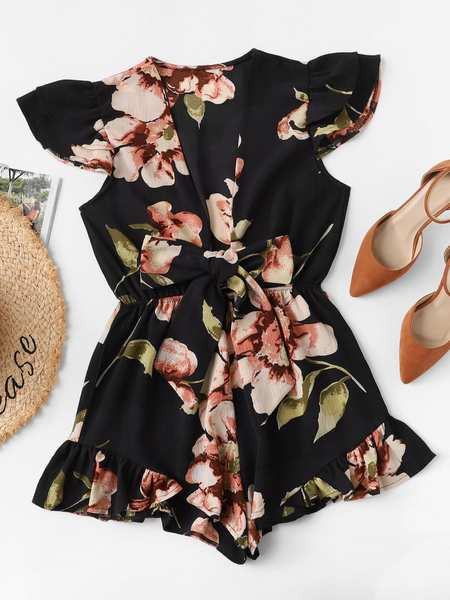 Modern női overál mély nyakkivágással és két színű szalaggal