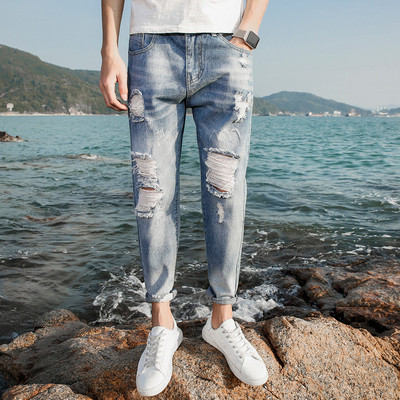 Modern férfi farmer szakadt motívumokkal, kék színben többféle modellel