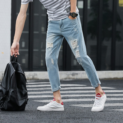 Modern férfi farmer szakadt motívumokkal, kék színben többféle modellel