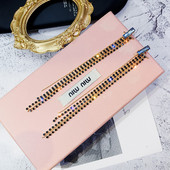 Női fülbevaló fekete díszkövekkel