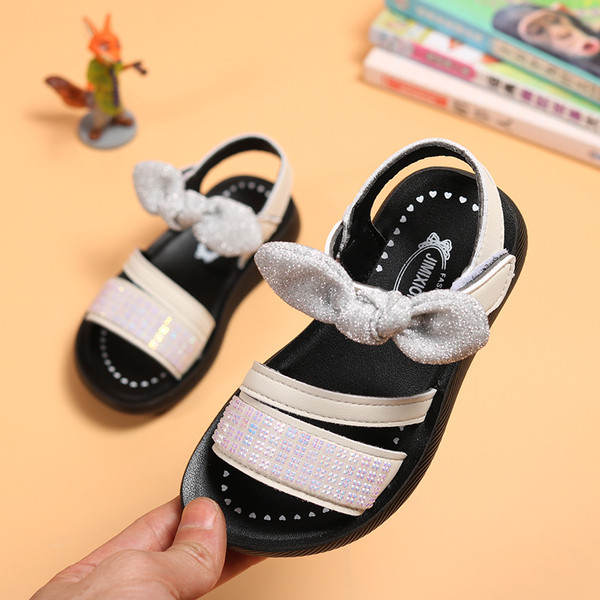 Modern gyerekszandál lányoknak kövekkel és szalaggal