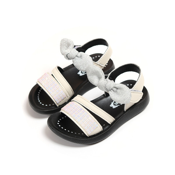 Modern gyerekszandál lányoknak kövekkel és szalaggal