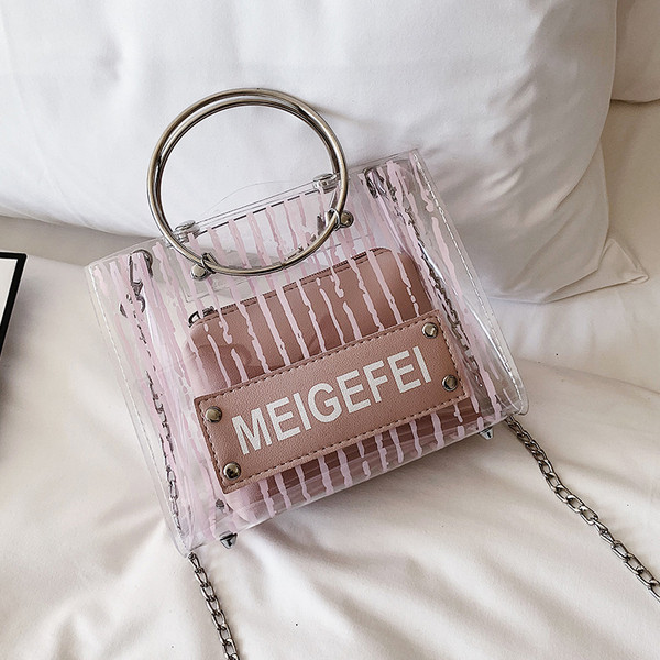 Modern női táska átlátszó huzattal és három színben, rövid és hosszú fém fogantyúval