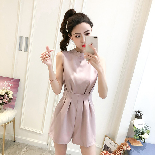 Modern női overál rózsaszín és fekete színben