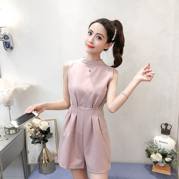 Modern női overál rózsaszín és fekete színben