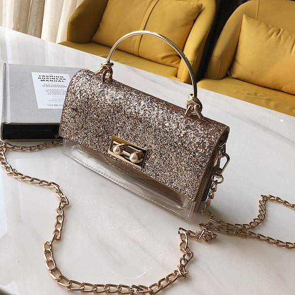 Κομψή γυναικεία τσάντα με λαμπερά στοιχεία και διαφανή  κάλλυμα με μεγάλη μεταλλική αλυσίδα
