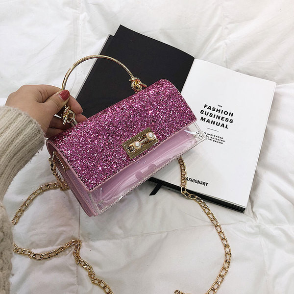 Κομψή γυναικεία τσάντα με λαμπερά στοιχεία και διαφανή  κάλλυμα με μεγάλη μεταλλική αλυσίδα