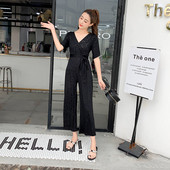 Stílusos női overall, fényes hatású fekete és sárga színben