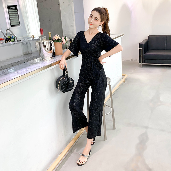 Stílusos női overall, fényes hatású fekete és sárga színben