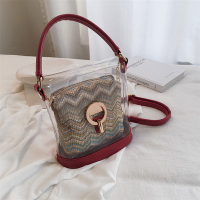 Modern női táska átlátszó huzattal öt színben, fém elemekkel és hosszú fémlánccal