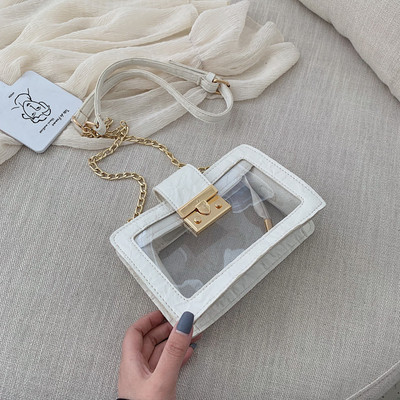 Modern átlátszó táska fém rögzítéssel és hosszú fém fogantyúval