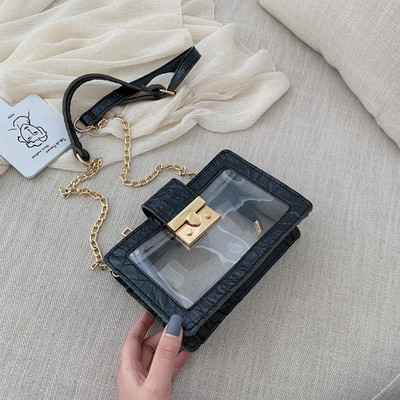 Modern átlátszó táska fém rögzítéssel és hosszú fém fogantyúval