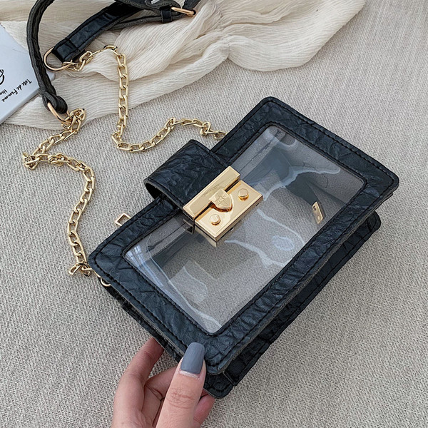 Modern átlátszó táska fém rögzítéssel és hosszú fém fogantyúval