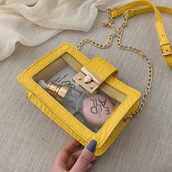 Modern átlátszó táska fém rögzítéssel és hosszú fém fogantyúval