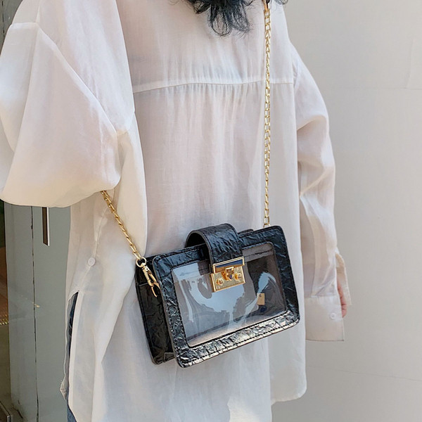 Modern átlátszó táska fém rögzítéssel és hosszú fém fogantyúval