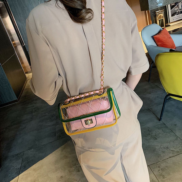 Geantă de damă modernă în patru culori cu husă transparentă și lanț metalic lung