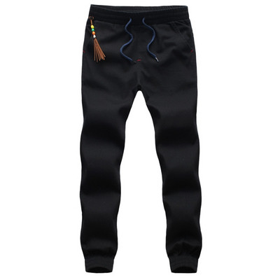 Sport és alkalmi férfi nadrág négy színben, bojttal