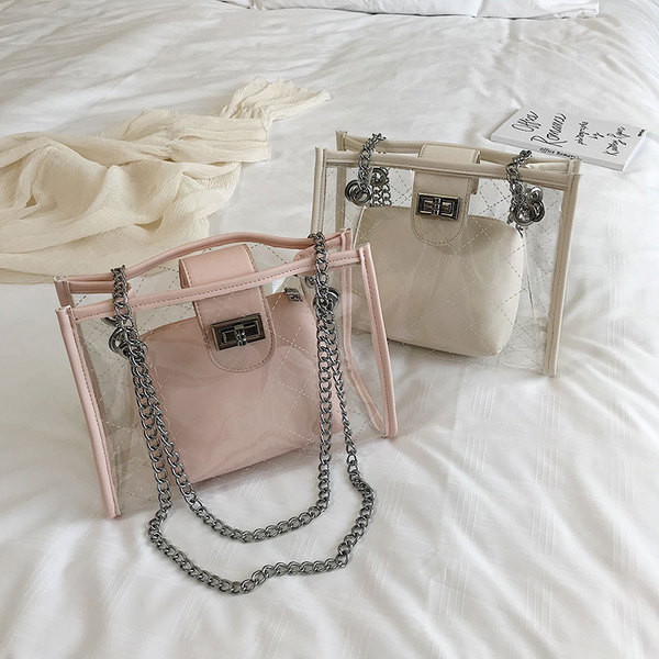 Geanta de dama moderna cu husa transparenta in patru culori cu inchizatoare metalica si lant metalic lung