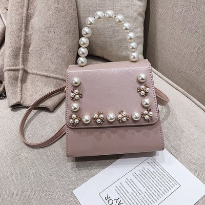 Κομψή γυναικεία τσάντα σε τέσσερα χρώματα με διακοσμητικά μαργαριτάρια και μακρά λαβή