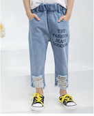 Παιδικά τζιν για κορίτσια με επιγραφές και σχισμένα μοτίβα