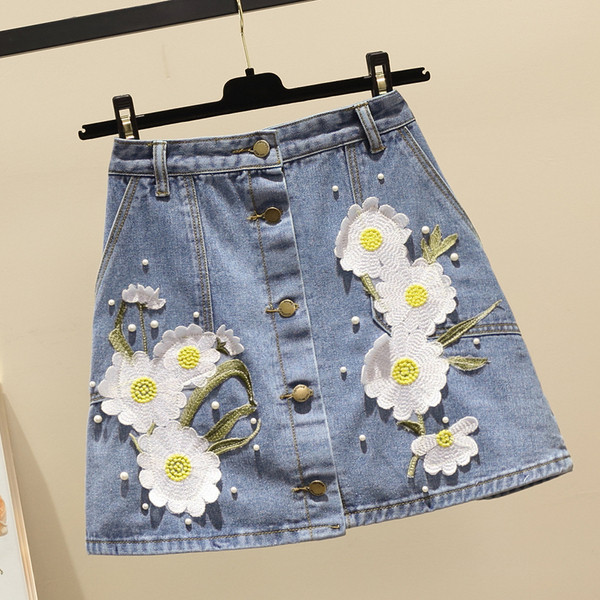 Fusta de damă elegantă din denim cu elemente 3D