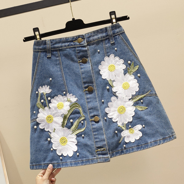 Fusta de damă elegantă din denim cu elemente 3D