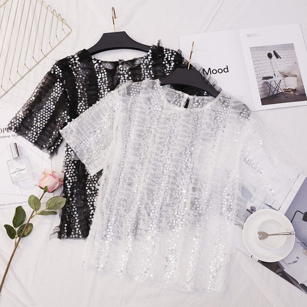 Bluză de damă elegantă în alb și negru cu paiete