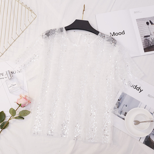 Bluză de damă elegantă în alb și negru cu paiete