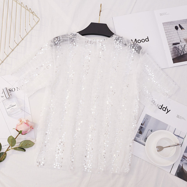 Bluză de damă elegantă în alb și negru cu paiete