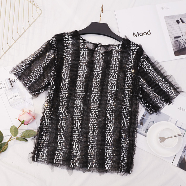 Bluză de damă elegantă în alb și negru cu paiete