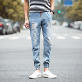 Modern férfi farmer két színben, fűzős, szakadt motívumokkal